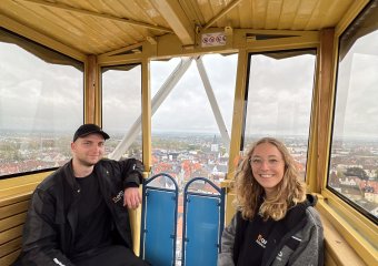Two people in a Ferris wheel